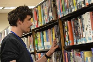 Aaron Epelbaum shelves books at the Eagle River Library. Photo courtesy of Ramah Wisconsin.